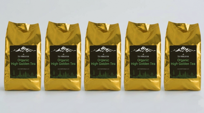 Five gold foil bags of Tea Mountain Organic High Golden Tea arranged in a row on a light gray background.