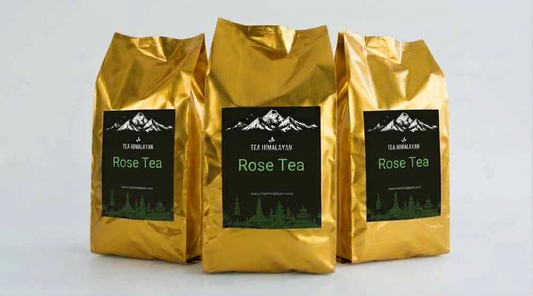 Three gold foil bags of Tea Himalayan Rose Tea arranged in a row against a light gray background.