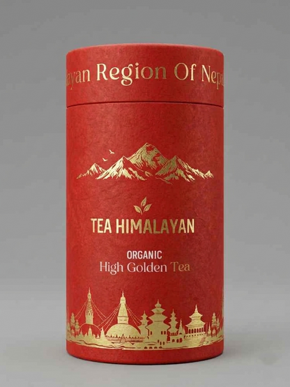 A cylindrical red tea tin with gold foil text reading 'TEA HIMALAYAN' and 'ORGANIC High Golden Tea,' plus gold mountain and architectural illustrations, photographed on a neutral gray background.